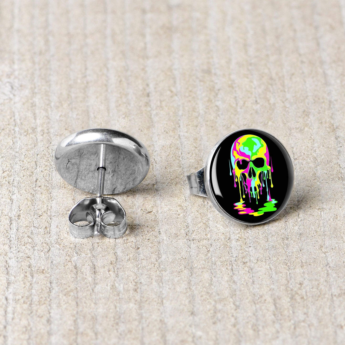 Ultra Bright Melting Skull Stud Earrings by Onyx O